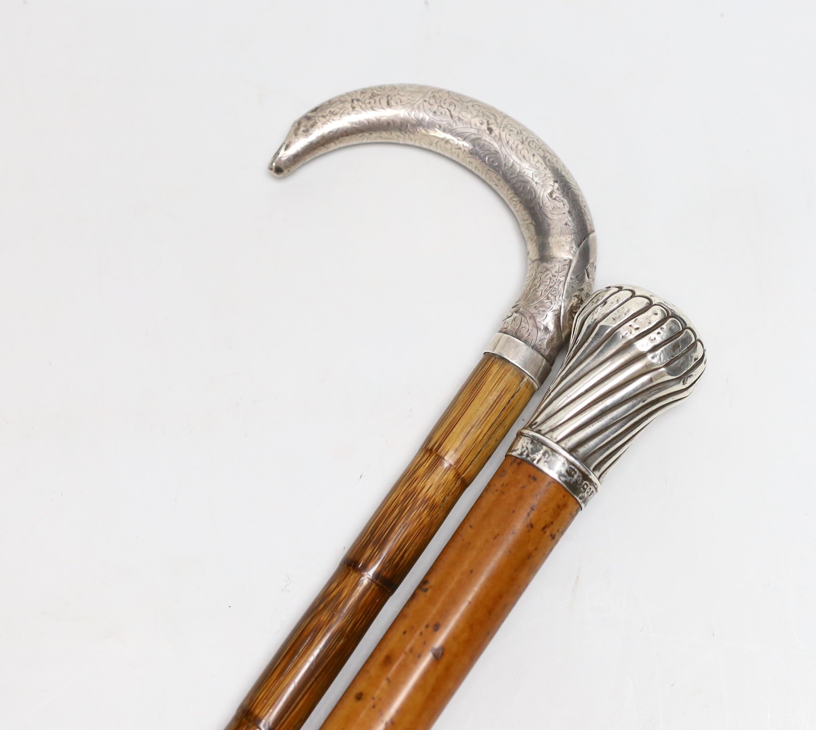 A silver-mounted malacca walking cane and a silver-mounted walking stick, 88cm